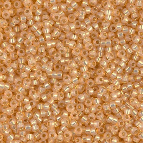 Close-up of small yellow peach-colored beads