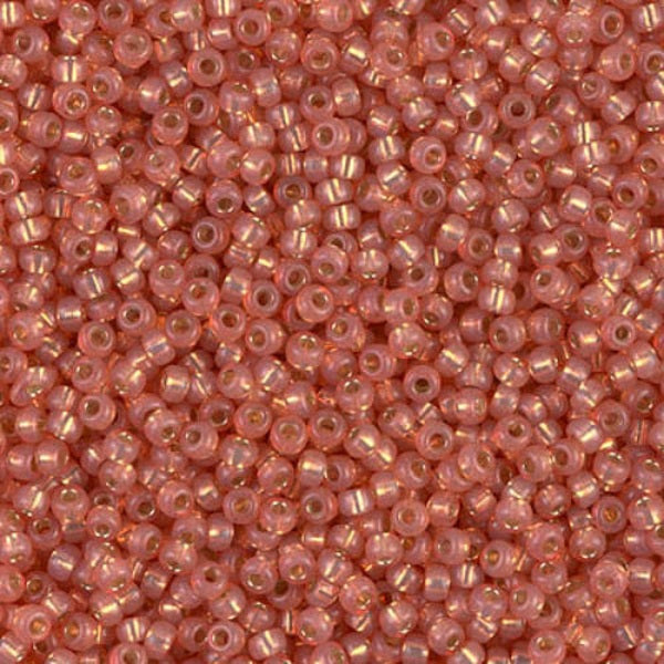 Close-up of small orange pink beads 