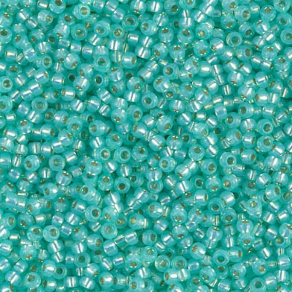 Turquoise glass beads with a metallic sheen
