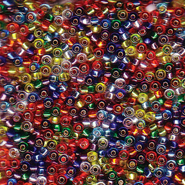 A dense pile of small glass seed beads in many colors, including red, blue, green, yellow, purple, and silver, filling the entire frame.